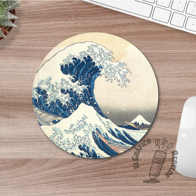 Mousepad rodó antilliscant al costat d'un teclat blanc.